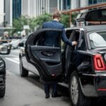 imgi 48 driver holds open door limousine so that gentleman goes inside 926199 4362678