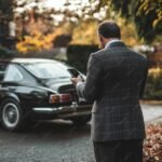 imgi 50 45yearold man suit looking his smartphone 1177187 137908